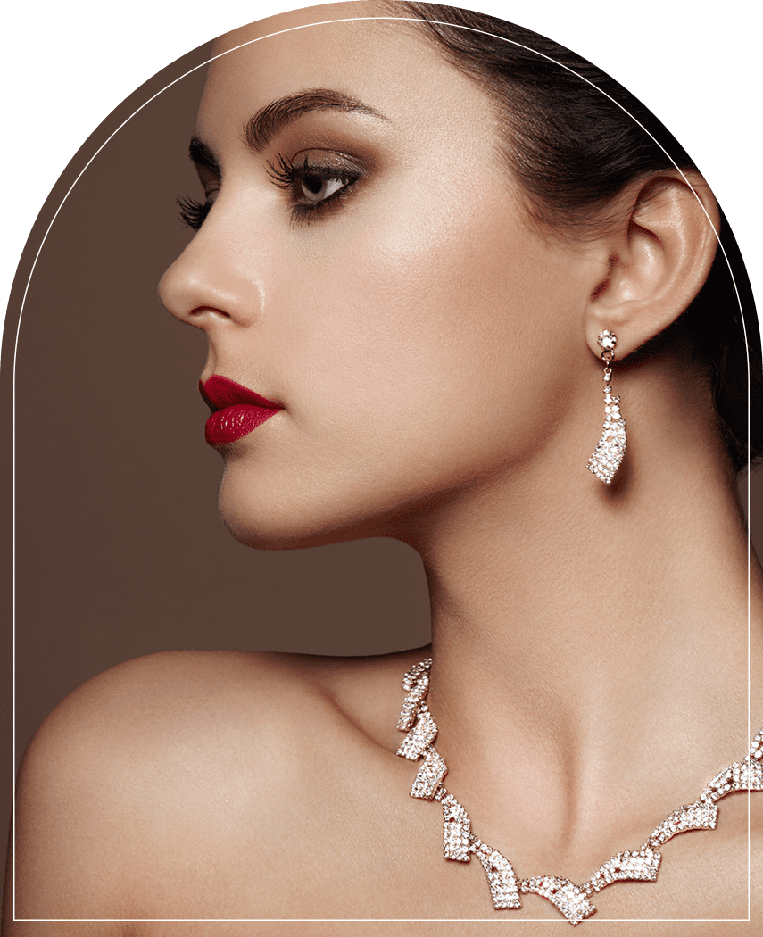 Woman wearing elegant jewelry, red lipstick.