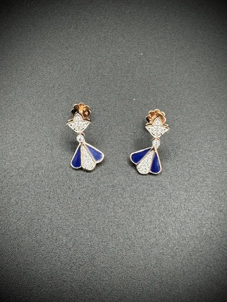 Elegant silver and blue angel-shaped earrings with rose gold accents.