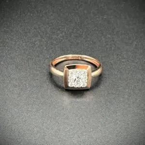 Elegant gold ring with a square diamond centerpiece.