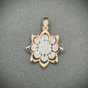 Elegant floral pendant with sparkling diamonds and rose gold details.