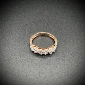 Elegant gold ring with a row of sparkling diamonds.