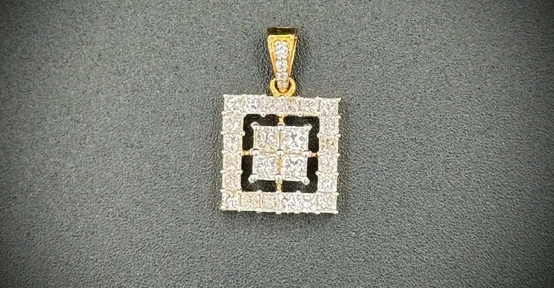 Square-shaped pendant with sparkling diamonds and gold bail.